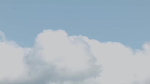 Clouds Moving in a Blue Sky