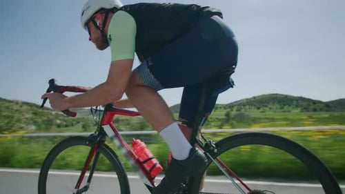 Closeup of a Cyclist Who is Engaged in Road Cycling