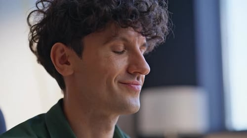 Young Adult Uses Smartphone in Home