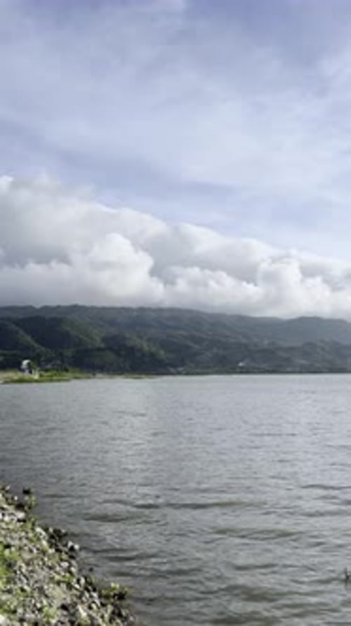 Scenic View of Lake and Mountains Under Sky