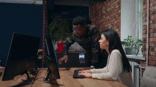 Modern Loft Office Black Man and Caucasian Woman Programmers and Data Analyst Working