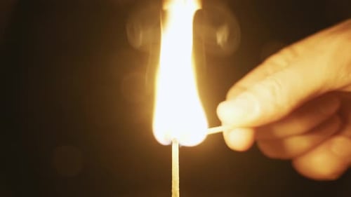 Match Ignites with Dark Background in a Close-Up