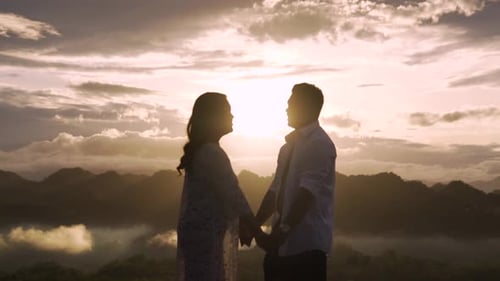 Silhouetted Couple Kissing at Romantic Sunset