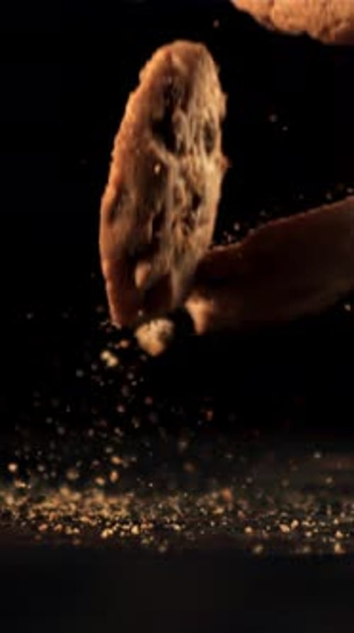 Cookies with Pieces of Chocolate Fall on the Table and Crumble Filmed is Slow Motion 1000 Fps