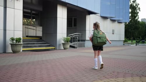 Modern School For First Graders Elementary Education Girl With Backpack Going To School Entrance