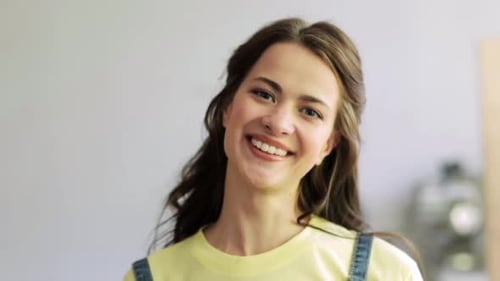Smiling Young Woman Posing in Studio