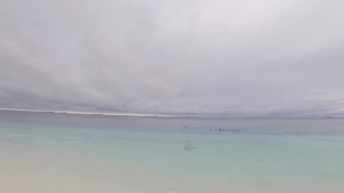 Tropical Ocean and Beach on a Cloudy Day