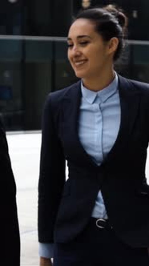 Vertical of Businesspeople Have Conversation Outdoor in Business District