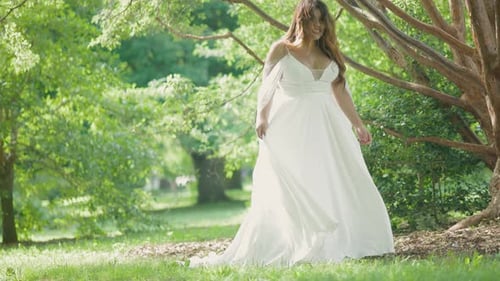 Woman in White Dress in Green Nature Setting