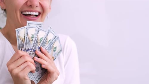 Excited Smiling Woman Showing Cash Money 1000 American Dollars Banknotes Hands with Money Close Up