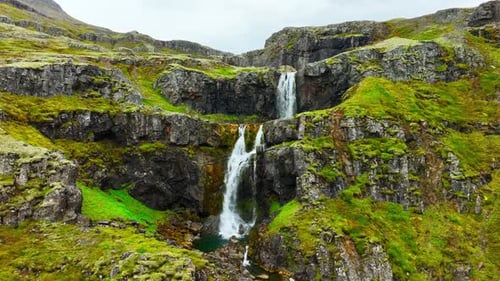 Wispy Waterfalls Flowing Over Cliff Mountain River Falling Over Cliff Creating Many Waterfalls with