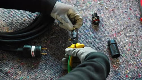 Electrical Cord Repair with Pliers Close Up