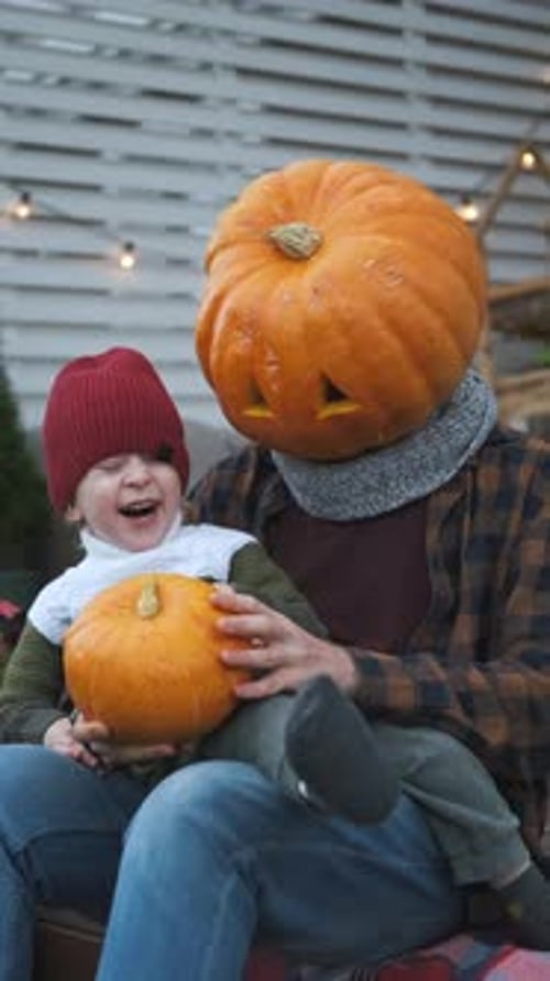 Cute Toddler and Adult with Pumpkin Head