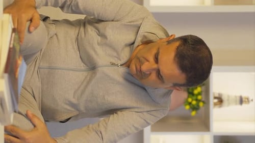 Vertical video of Man experiencing pain in bones.