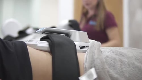 Woman Receiving Medical Treatment on Abdomen