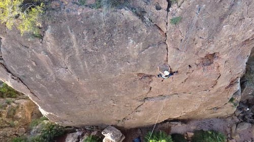 Murcia, Spain, October 29, 2024: Sportsperson rock climbing in slow motion at a wall rock