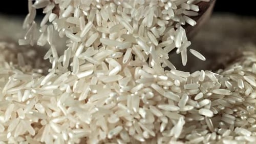 White Rice Grains Falling in Pile