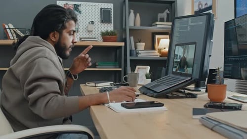 Software Engineer Having Video Call with Manager at Home