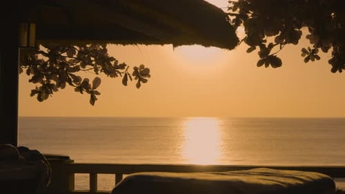 Golden Hour Sunset VIew From Hotel Spa With Massage Bed In Foreground. Bali, Indonesia. wide shot