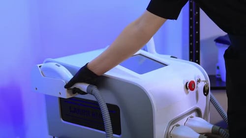 Medical Laser Machine Used with Black Gloves