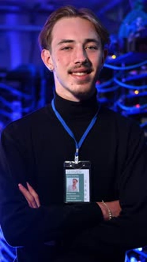 Smiling Young Adult in Server Room