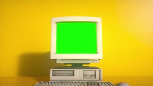 Retro Personal Computer with Keyboard on a Desktop with Green Screen