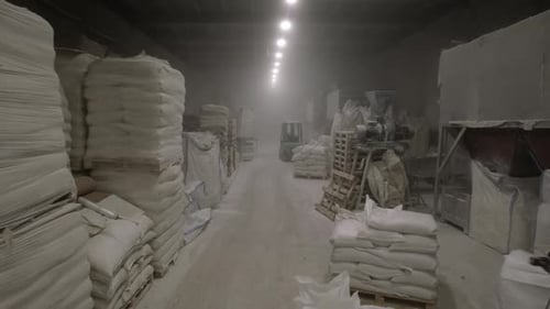 Industrial Warehouse Interior with Bags and Machinery