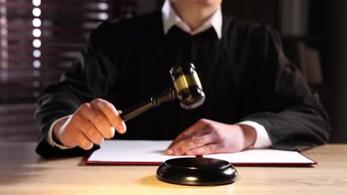 Unrecognizable Judge Presides over Court with Gavel
