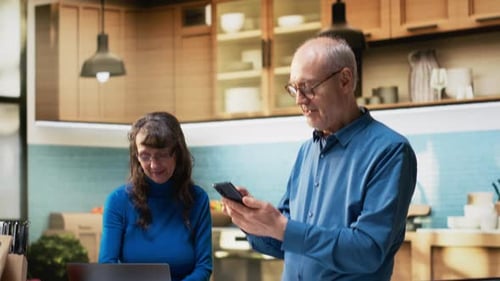 Senior Couple Using Technology in a Modern Kitchen