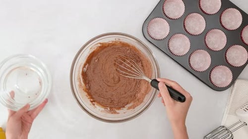 Mixing Chocolate Cupcake Batter with Whisk Overhead