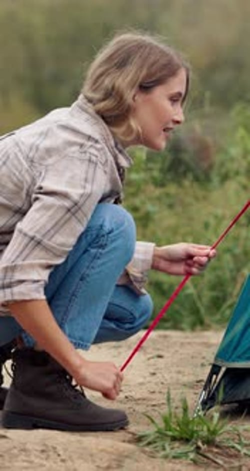 Camping, nature and woman in park with tent, forest and preparation for adventure