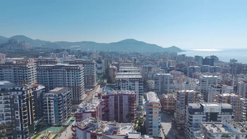 Aerial Video Aerial Perspective of a Coastal City With Modern Buildings and Clear Views of the