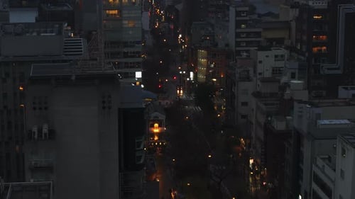 Multistorey Buildings Along Street in City at Night Aerial View of Town Development in Urban Borough
