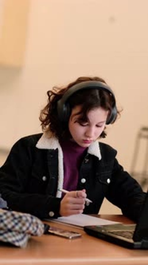 Teen Girl Studying at Desk with Laptop