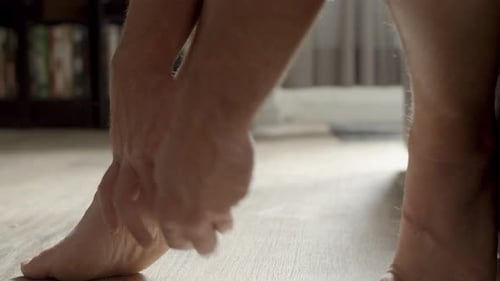 Applying Medical Bandage to Injured Heel