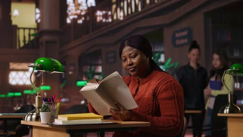 Student Reading in Grand Library Study Hall