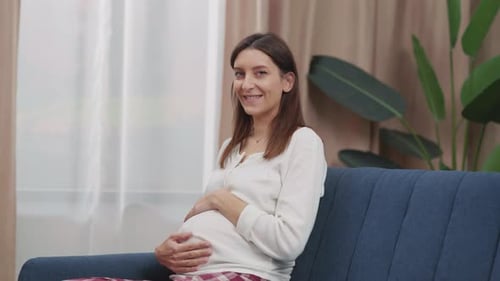 Portrait Cheerful Young Caucasian Pregnant Woman Expecting Child Touching and Embracing Gently Her