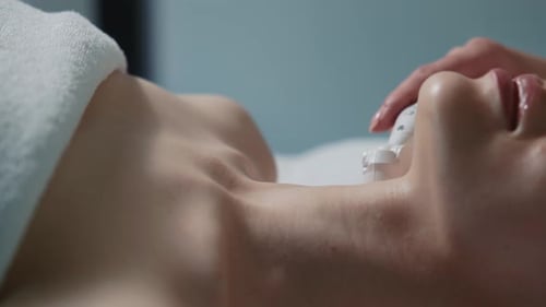 Footage of Cosmetic Procedure on Female Neck Woman Lying in Beauty Clinic Receiving Treatment Skin
