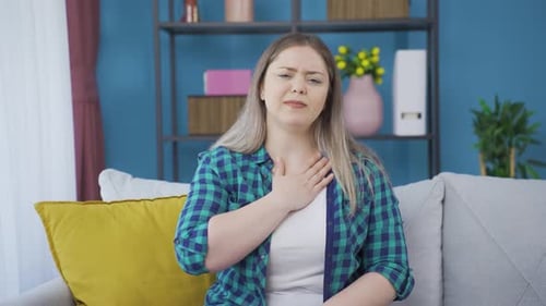 Young woman experiencing pain in bones.