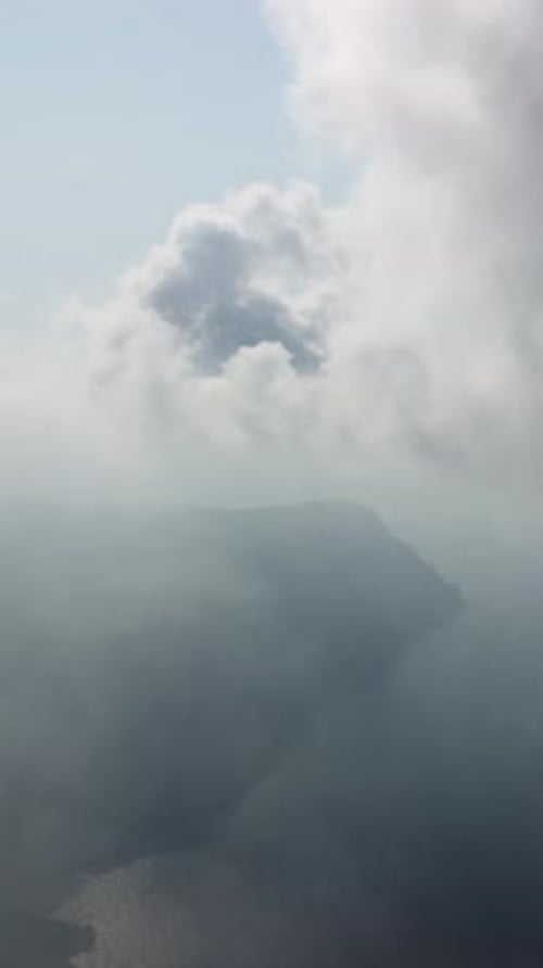 Aerial Vertical View Over Foggy and Fluffy Clouds Blue Sky Sun and Sea Fog Abstract Aerial Nature