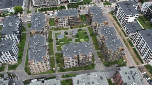 Drone top-down view of modern apartment blocks around a landscaped courtyard in Vilnius, Lithuania,