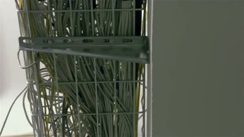Close Up of Data Cables in Wire Rack