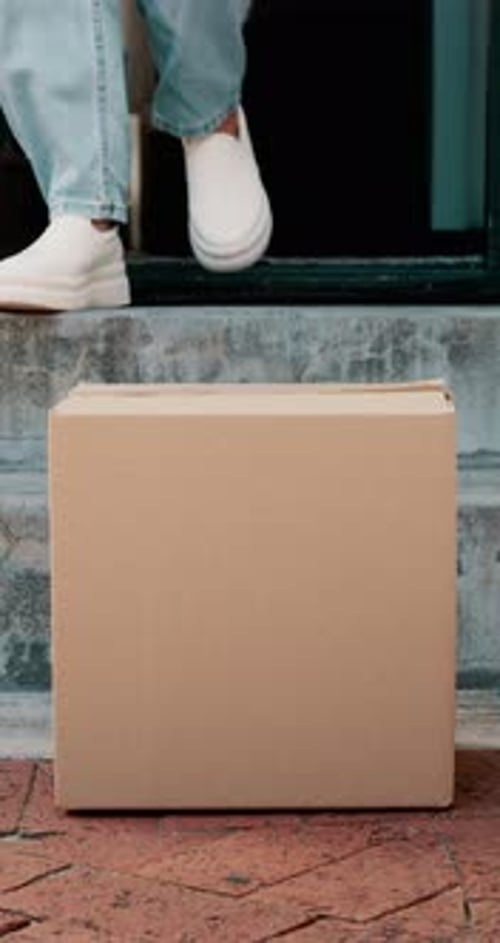 Home, front door and woman with box, delivery and product with logistics, ecommerce and parcel