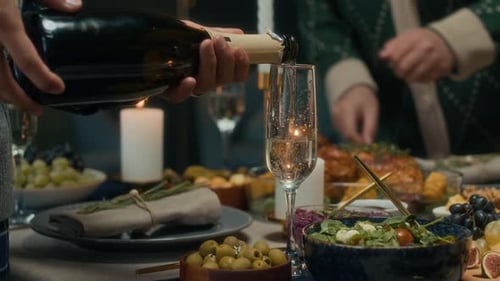 Champagne Pour at Elegant Holiday Dinner Party