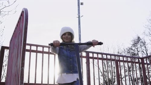 Caucasian Little Boy Looking Cheerful at Camera on Skateboard Outdoor Playground Happy Child