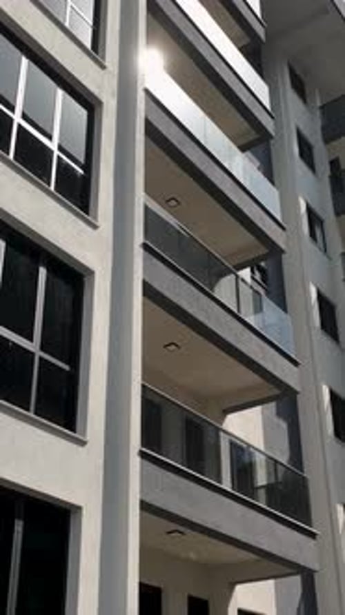 Vertical Video Modern Apartment Building Facade with Bright Colors and Clean Architectural Lines