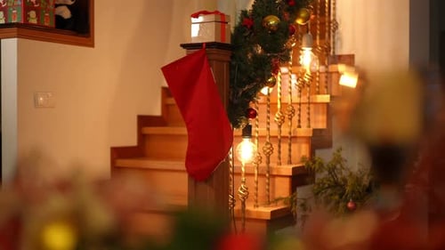 The Camera's View Through the Tinsel Going Down the Stairs a Girl in Pajamas with Delight on Her