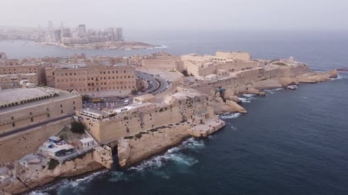 Sideway movement to the left over the port of Valletta Malta with mighty Fort in View