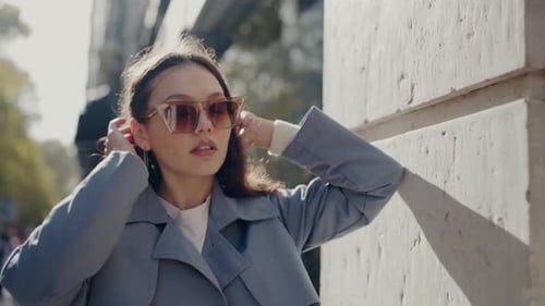 Fashionable Young Woman in Sunglasses Enjoying Sunny City Day