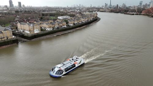 Drone View of Thames Clipper Boat Sailing on River Thames, London